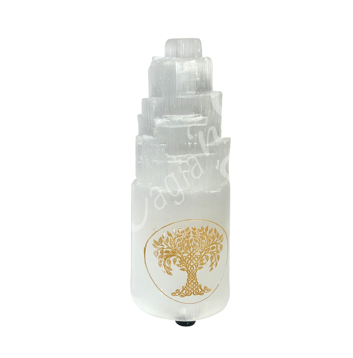 Selenite iceberg carving with white rubber feet. The lamp is engraved with a gold Tree of Life, seen with an other angle.