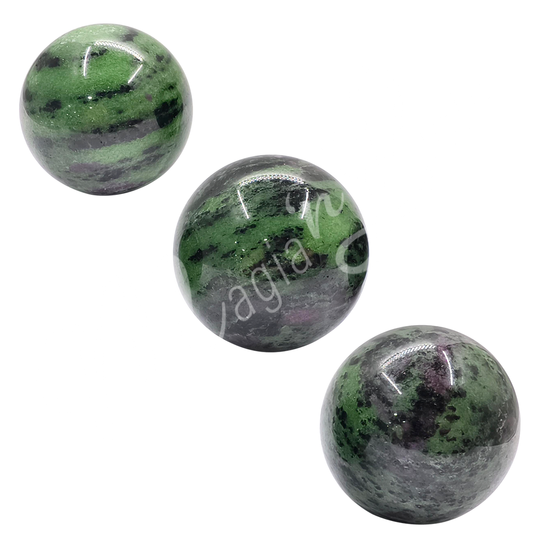 Three spheres made of ruby zoisite.