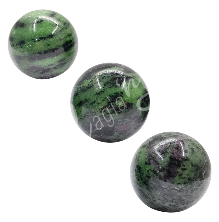 Three spheres made of ruby zoisite.