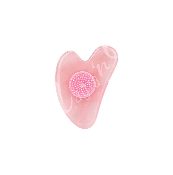 Rose Quartz heart-shaped gua sha with a textured circular grip in the center, designed for facial massage and skincare.