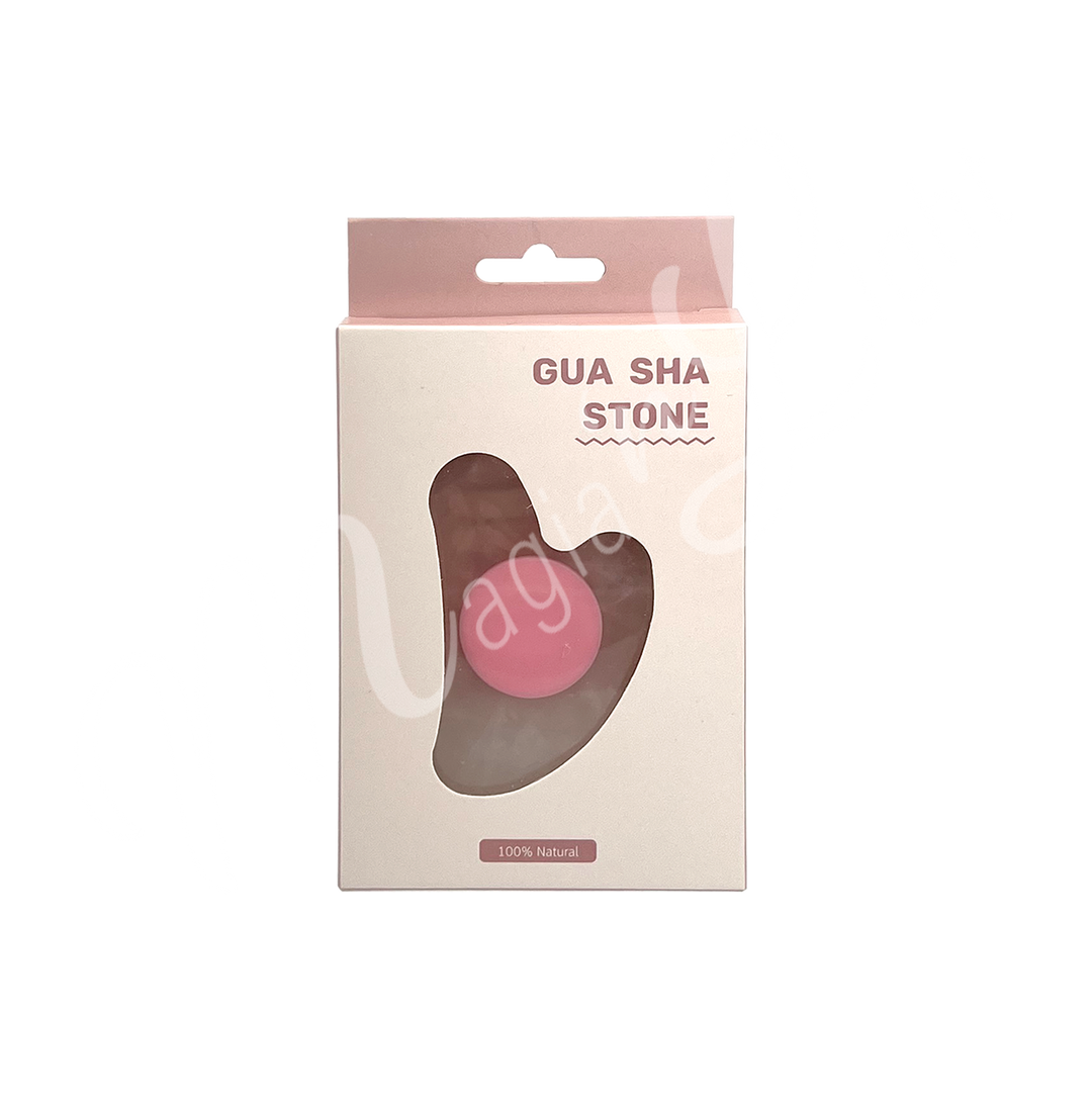 Rose Quartz gua sha stone in retail packaging labeled “Gua Sha Stone,” with a heart-shaped cutout revealing the product inside and “100% Natural” printed at the bottom.
