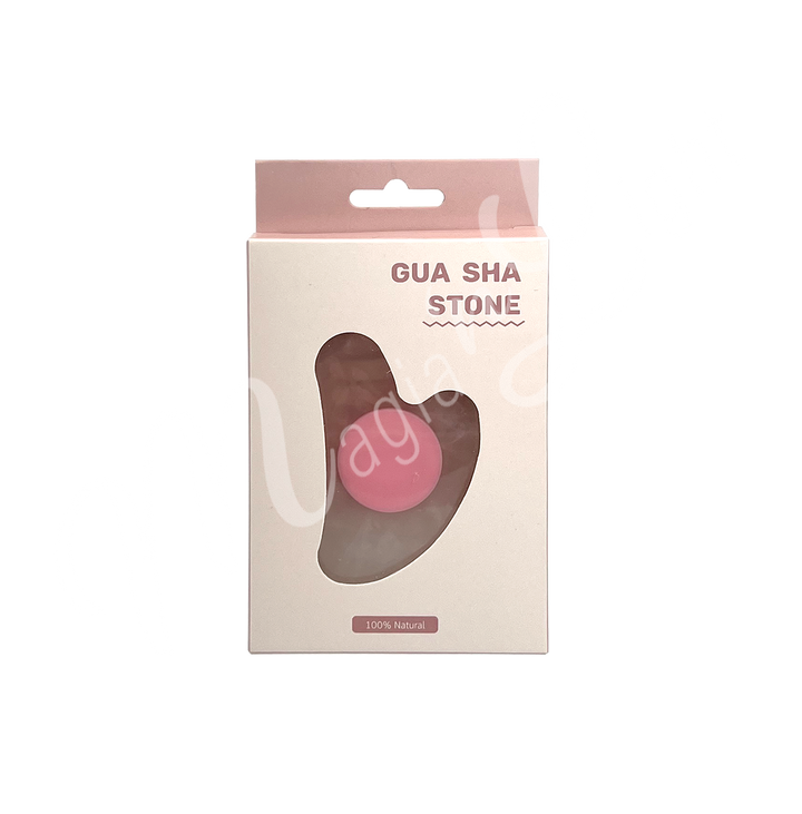 Rose Quartz gua sha stone in retail packaging labeled “Gua Sha Stone,” with a heart-shaped cutout revealing the product inside and “100% Natural” printed at the bottom.