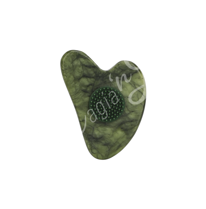 Jade heart-shaped gua sha with a textured circular grip in the center, designed for facial massage and skincare.