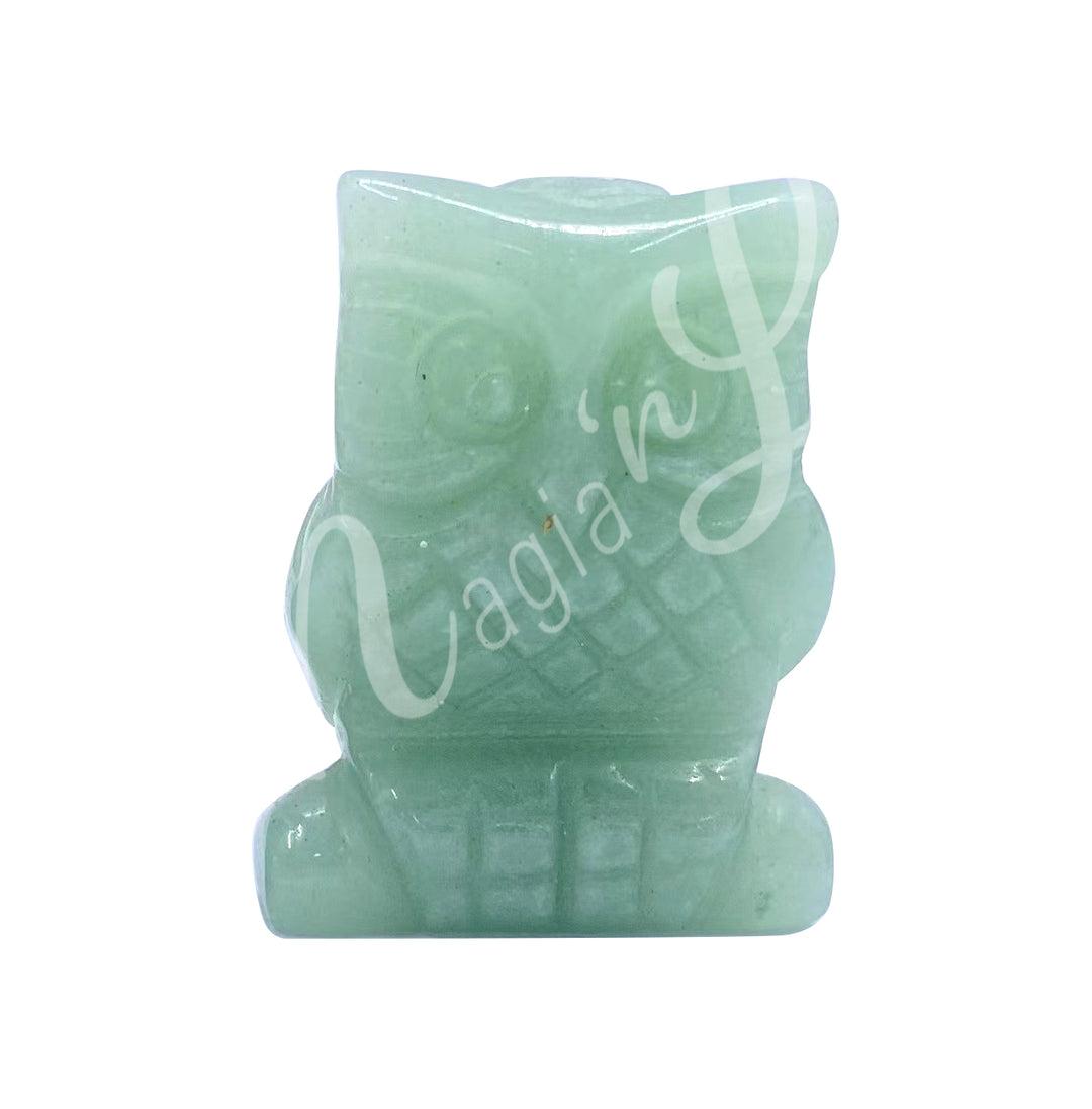 A carving of an owl made of green aventurine.