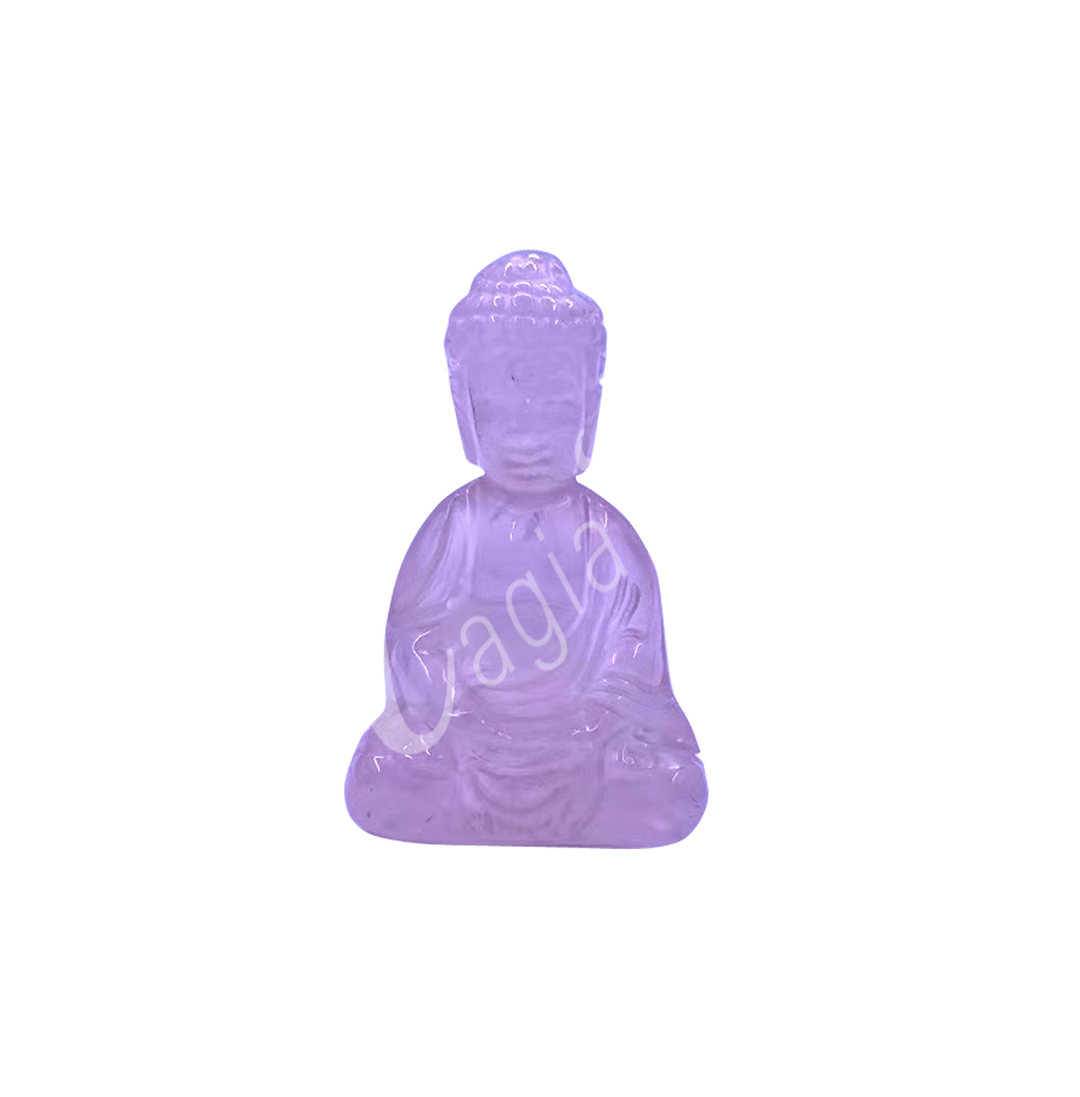 A carving of a Buddha made of Rose Quartz.