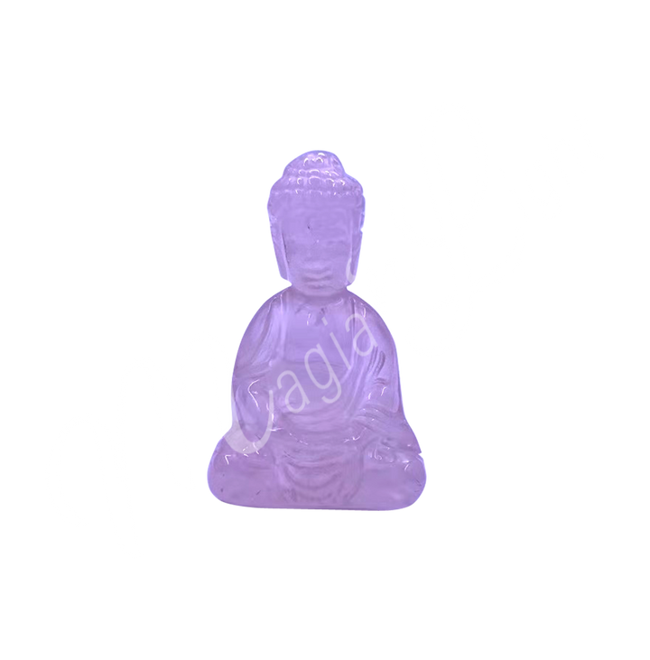 A carving of a Buddha made of Rose Quartz.