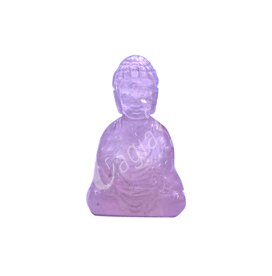 A carving of a Buddha made of Rose Quartz.