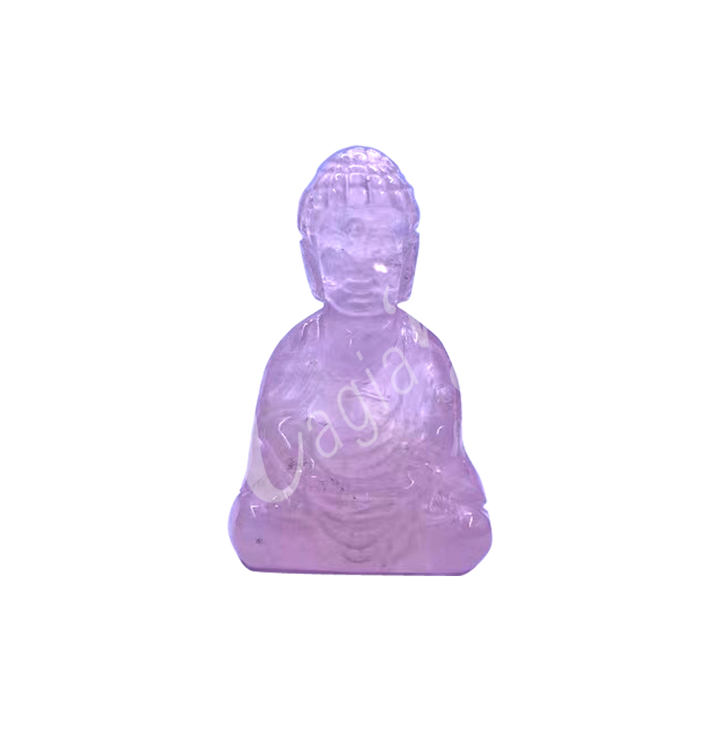 A carving of a Buddha made of Rose Quartz.
