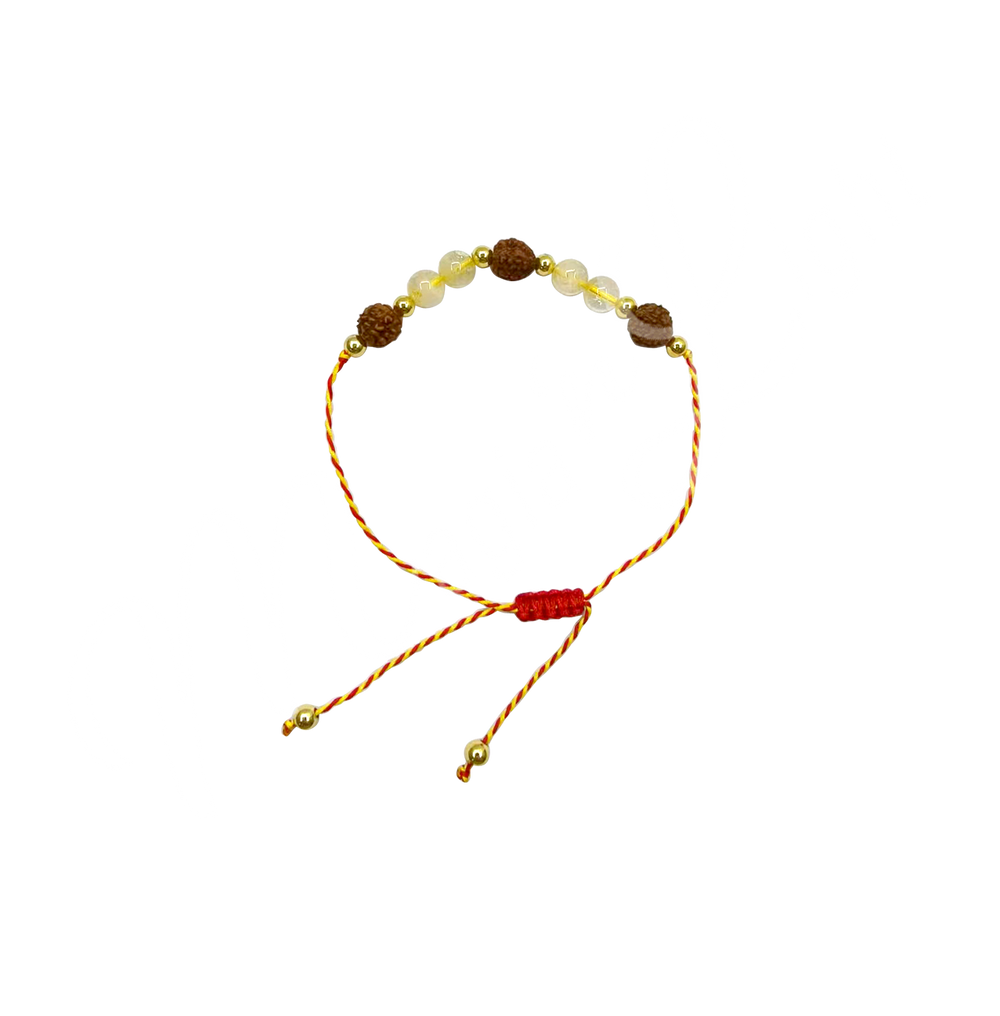 An adjustable red and yellow cord bracelet featuring an extendable design and a row of citrine and rudraksha beads.