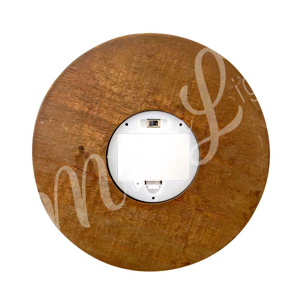 Seen from under the round wooden base, you can see the battery compartment and the on/off switch.