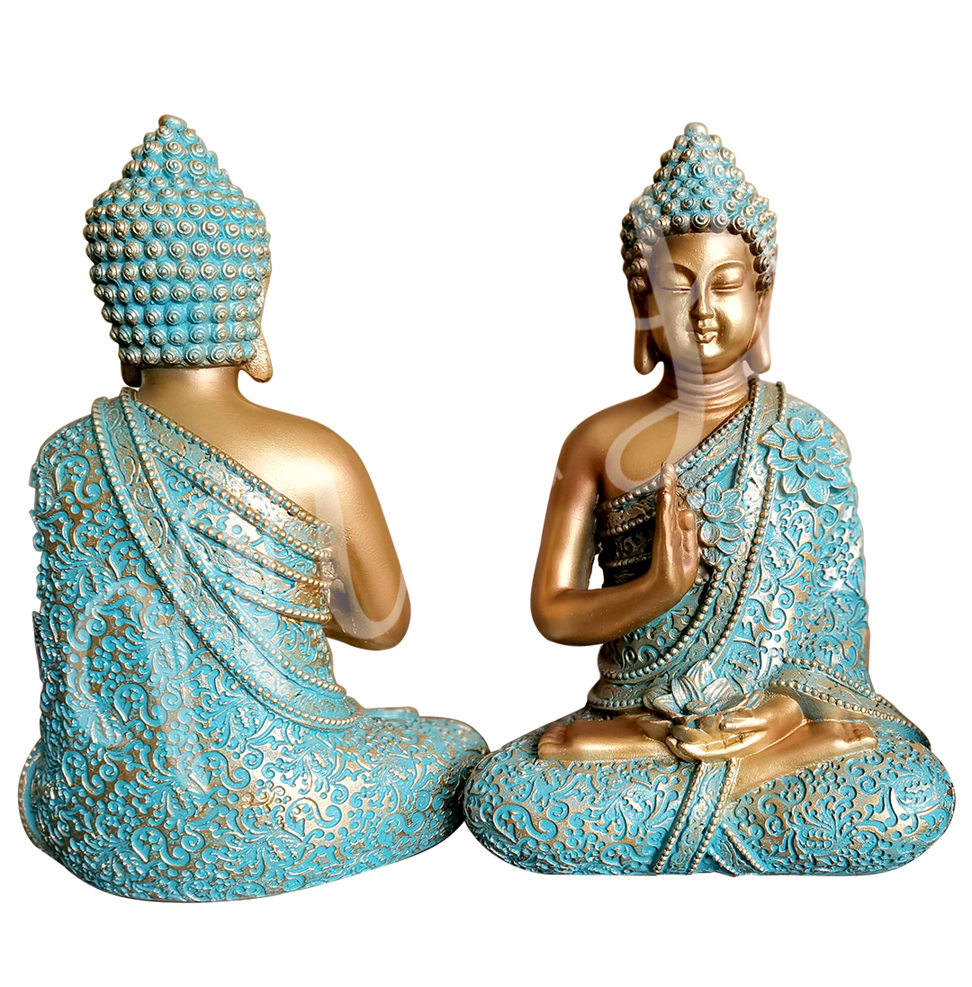 A gold and verdigris-colored resin statue featuring a seated Buddha in prayer, holding a lotus flower, shown back and front.
