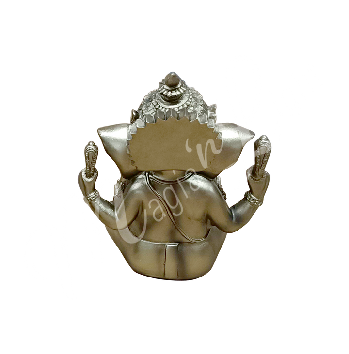 A gold-colored resin statue featuring the deity Ganesha seated, seen from the back.