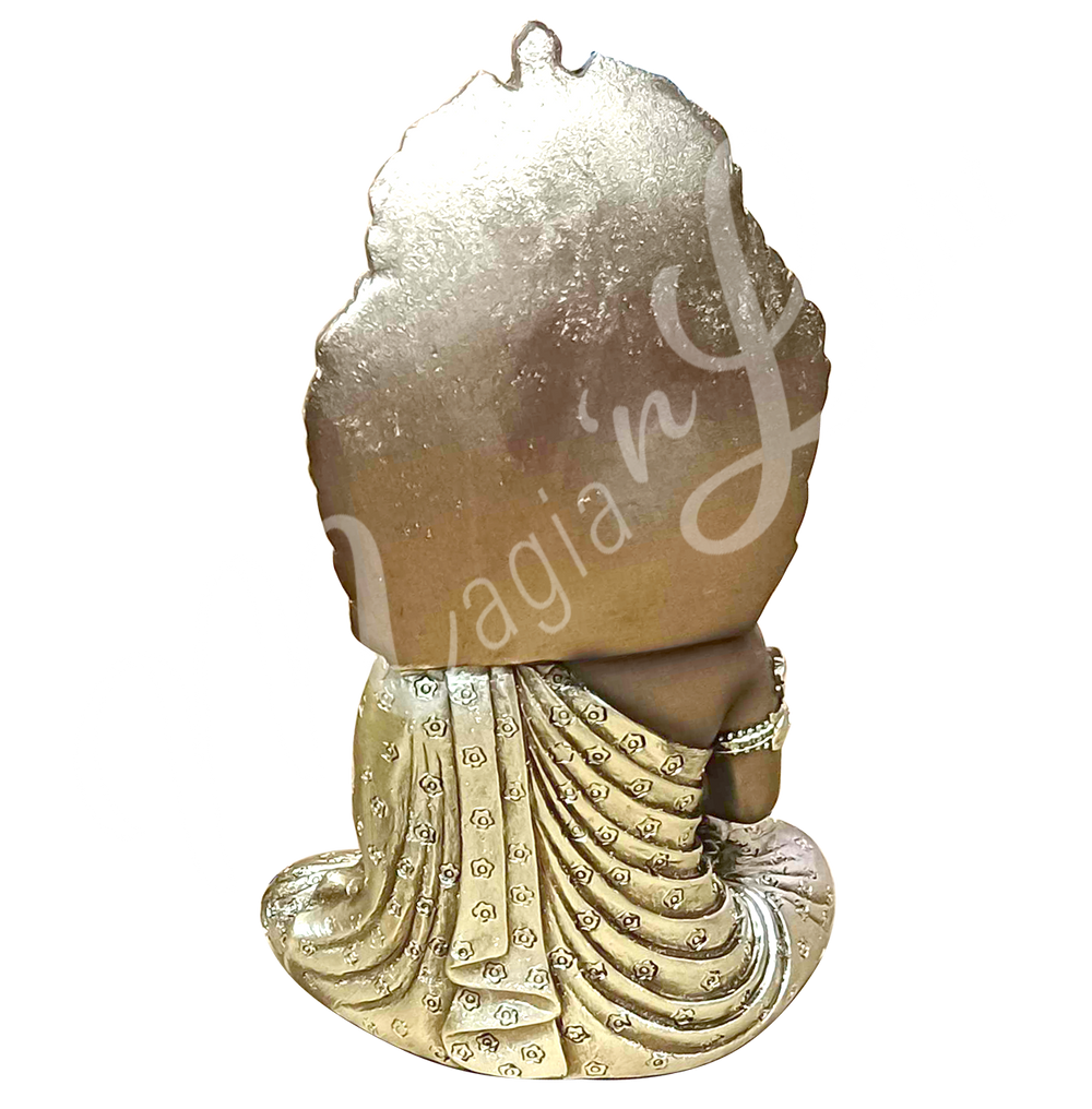 A gold-colored resin statue featuring a seated Balinese Buddha touching the earth, seen from the back.