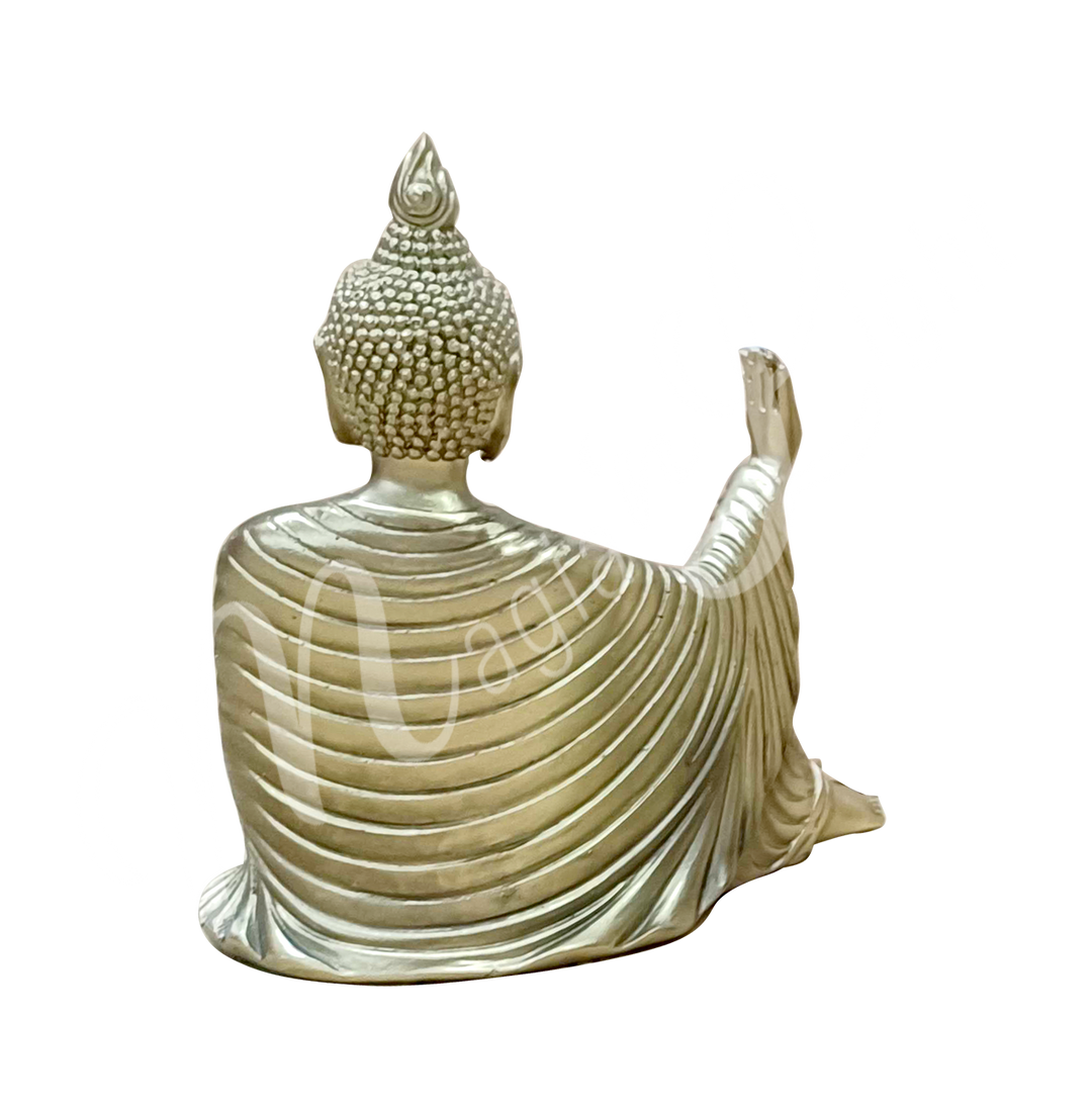 A gold-colored resin statue featuring a seated Buddha holding a lotus flower, seen from the back.