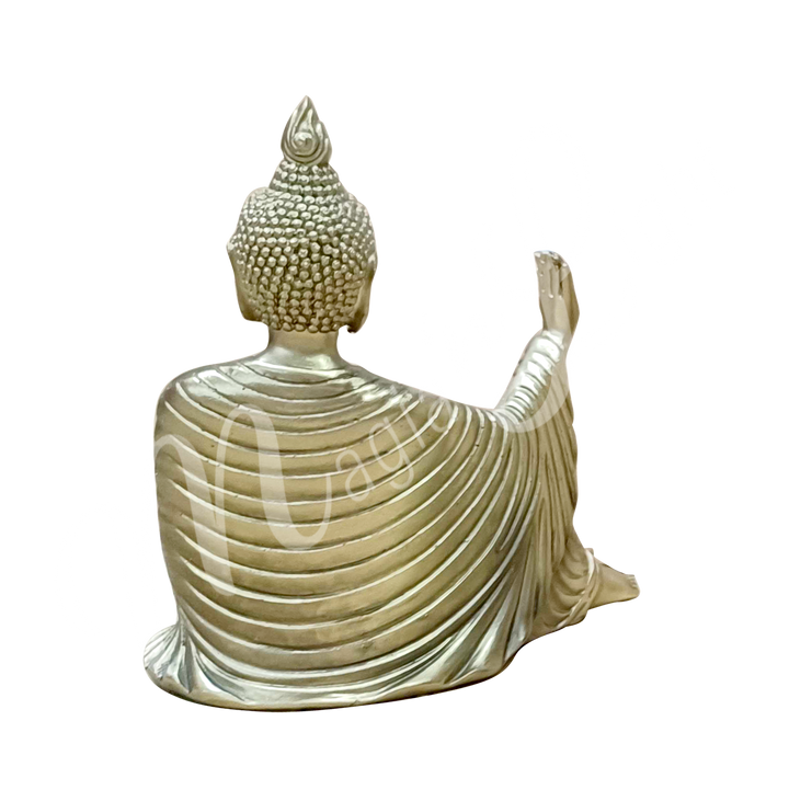 A gold-colored resin statue featuring a seated Buddha holding a lotus flower, seen from the back.
