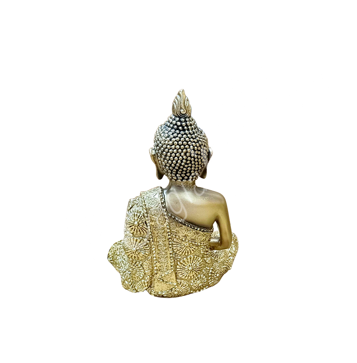 An antique gold-colored resin statue featuring a seated Buddha in meditation, seen from the back.