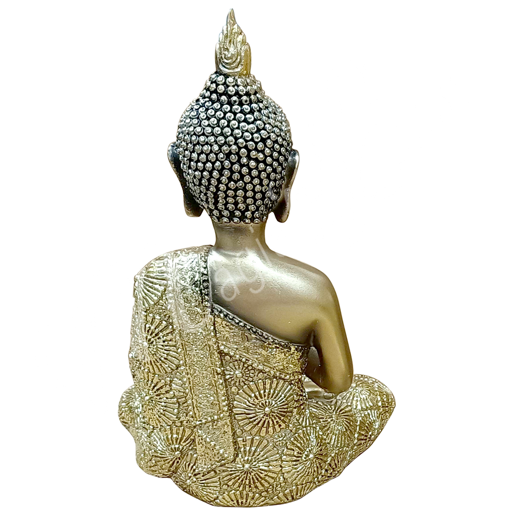 A gold-colored resin statue featuring a seated Buddha in prayer, seen from the back.