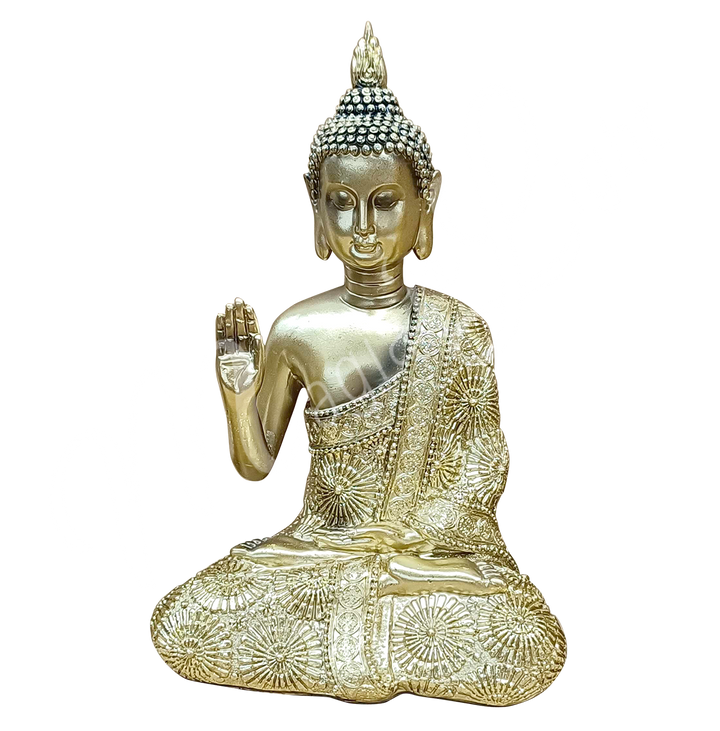 An antique gold-colored resin statue featuring a seated Buddha with a raised hand.