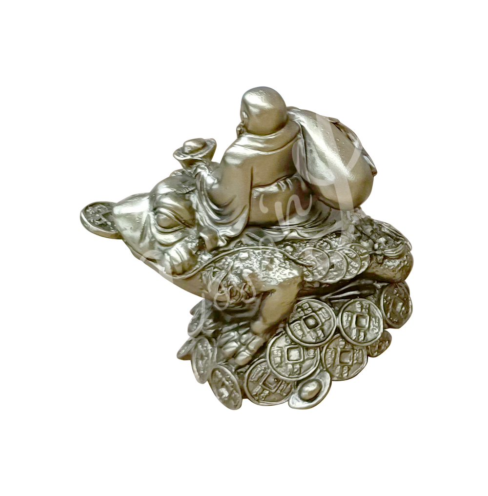 A gold-colored resin statue featuring a happy Buddha seated on a money frog, seen from the back.