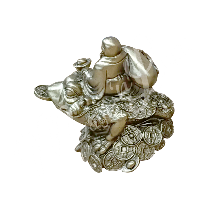 A gold-colored resin statue featuring a happy Buddha seated on a money frog, seen from the back.