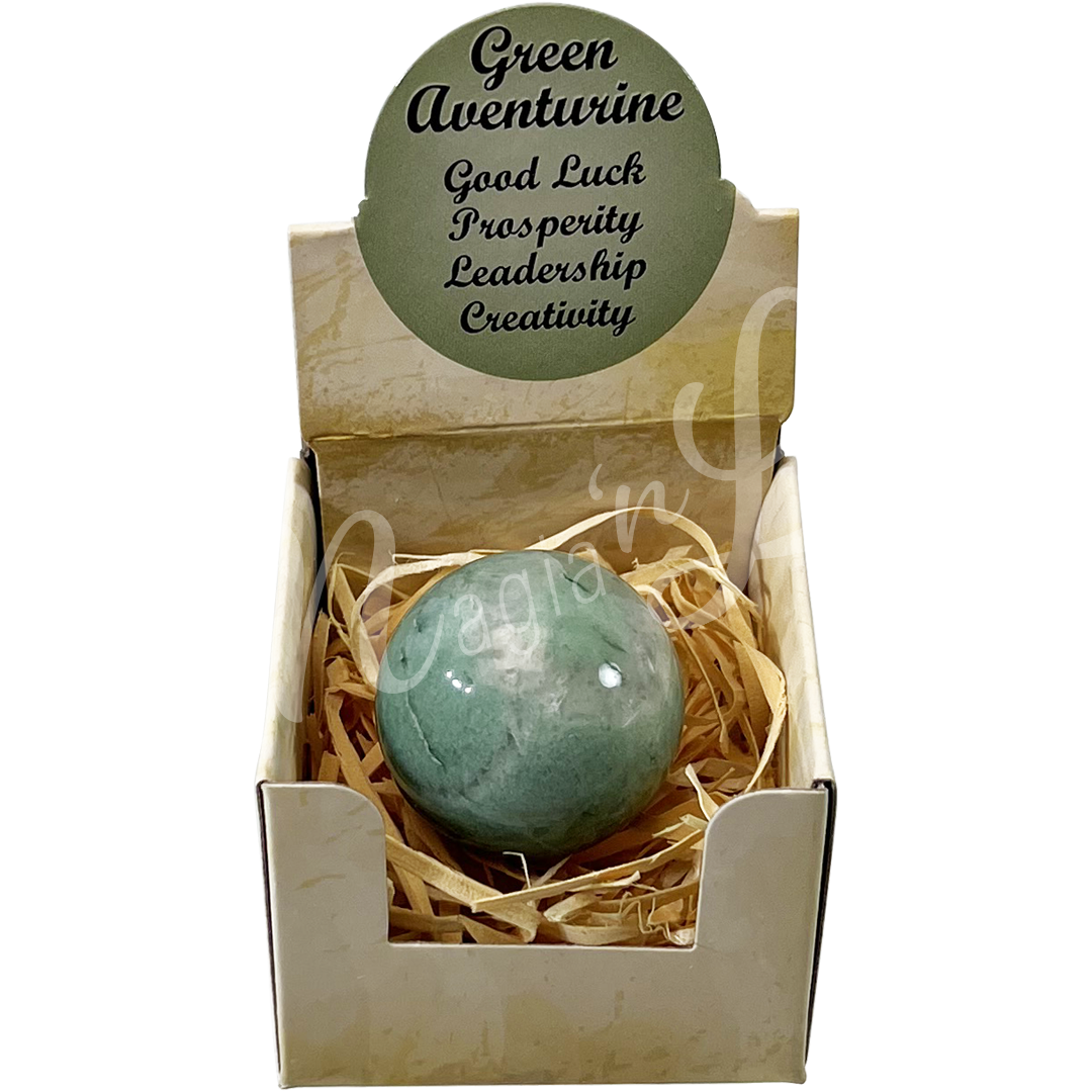 A open gift box with the words "Green Aventurine, Good Luck, Prosperity, Leadership, Creativity", showing a Green Aventurine sphere stone.