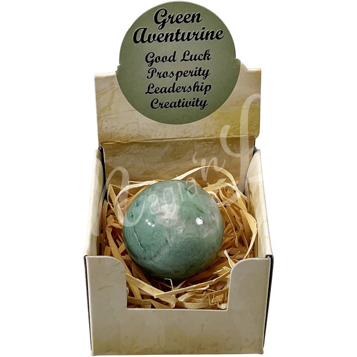 A open gift box with the words "Green Aventurine, Good Luck, Prosperity, Leadership, Creativity", showing a Green Aventurine sphere stone.