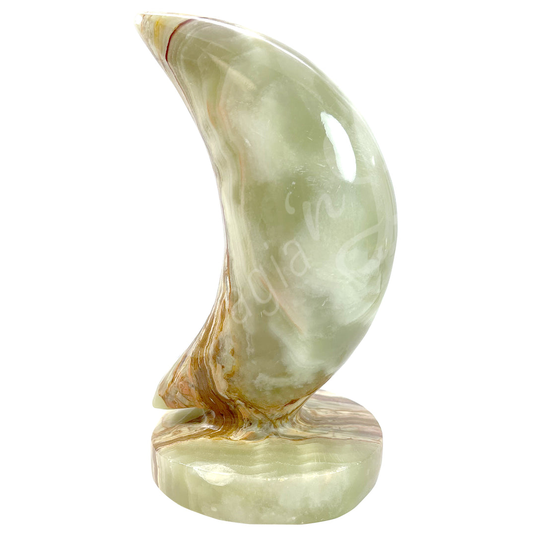 A moon-shaped Green Onyx crystal on a Green Onyx stand.