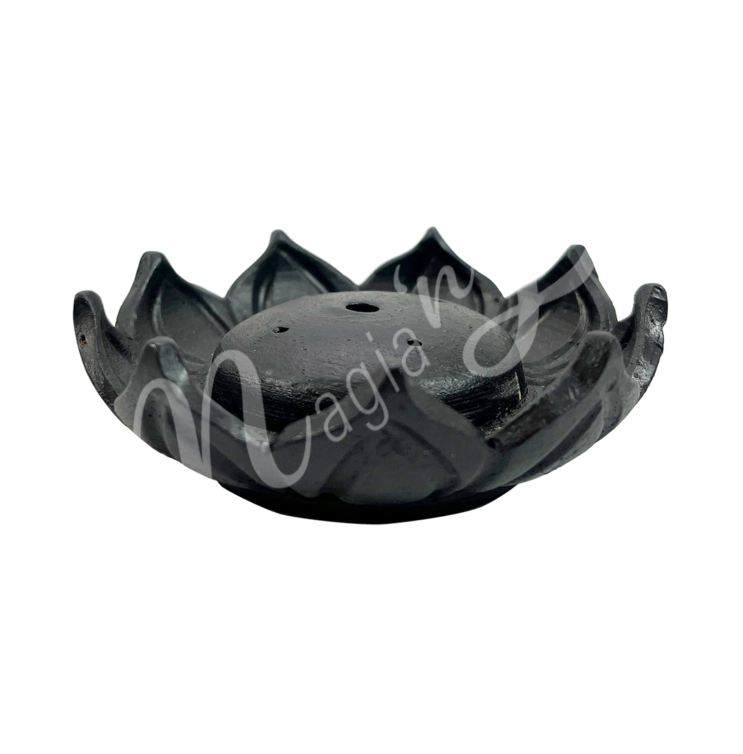 A black ceramic incense holder shaped like a lotus flower, seen from the side.