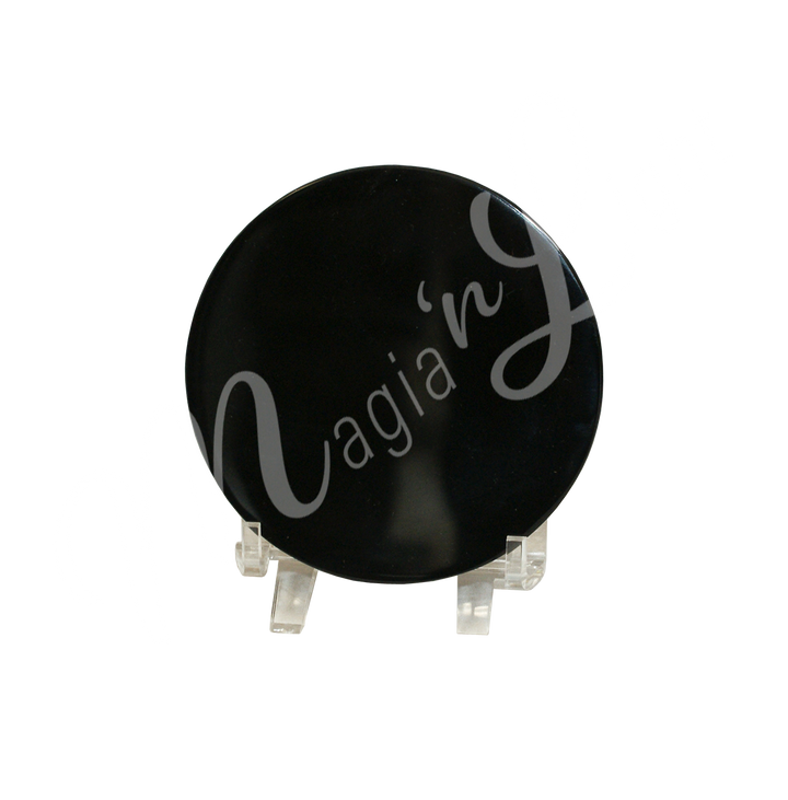 a round Scrying mirror made from obsidian, seen on a stand.