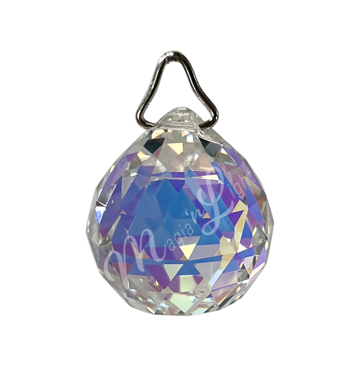 Faceted clear crystal ball prism with a teardrop shape, reflecting light and rainbow light.