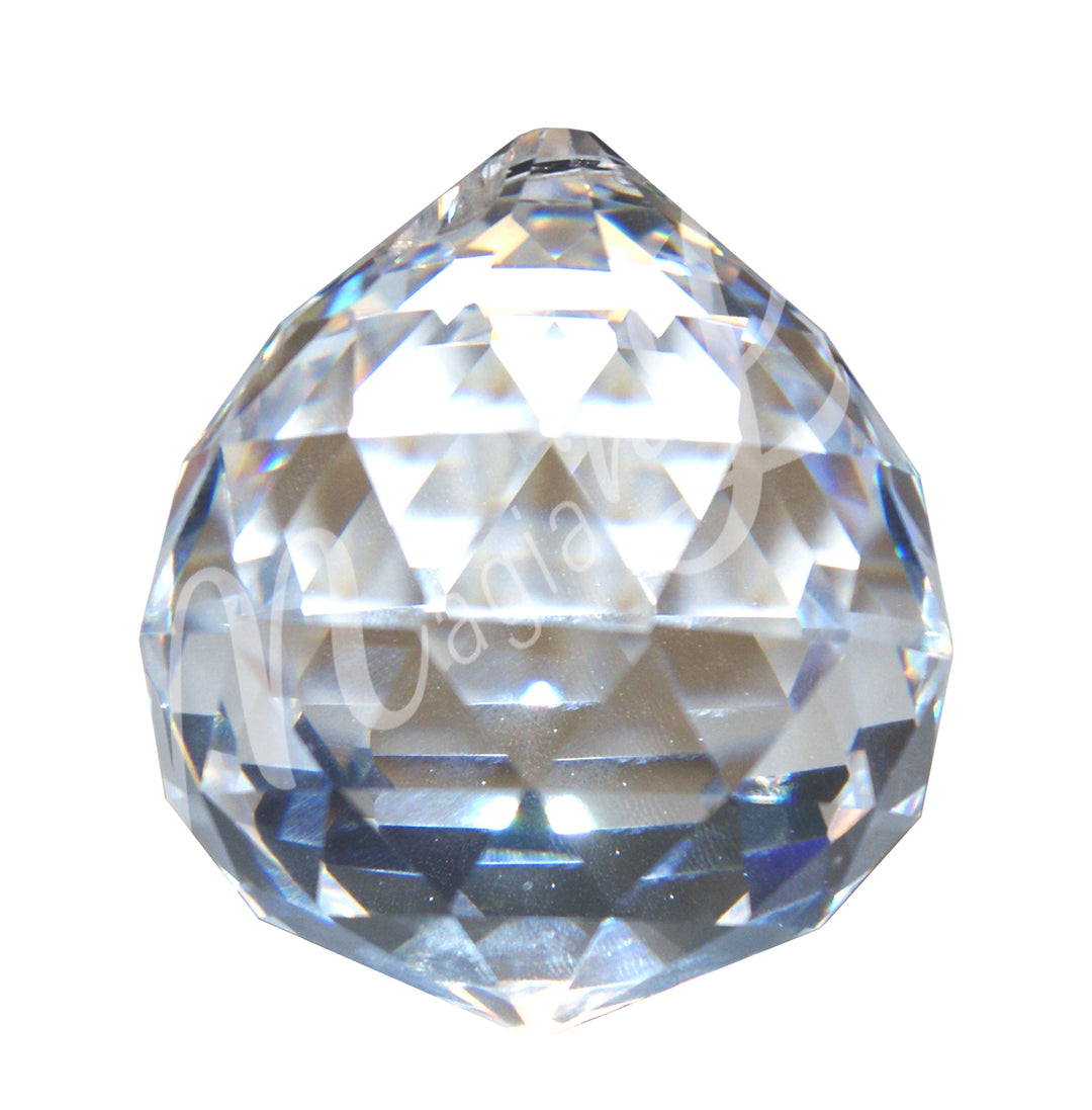 Faceted clear crystal ball prism with a teardrop shape, reflecting light and rainbow colors.