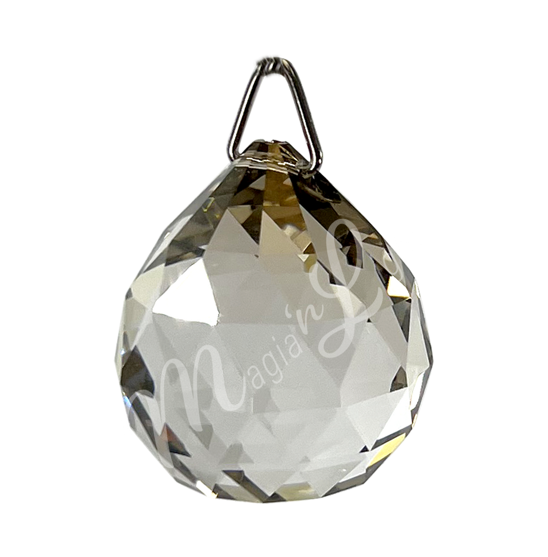 Faceted Honey crystal ball prism with a teardrop shape, reflecting light.