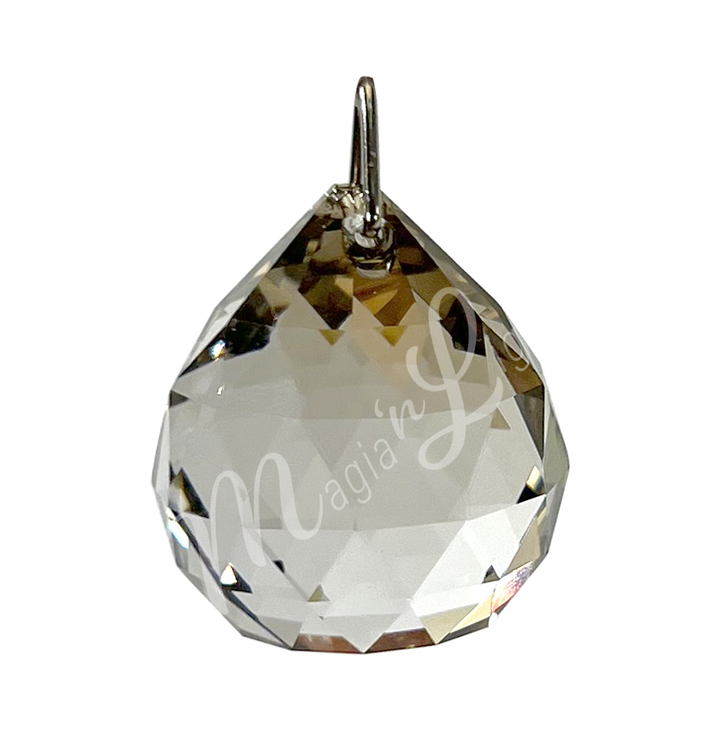 Faceted Honey crystal ball prism with a teardrop shape, reflecting light.