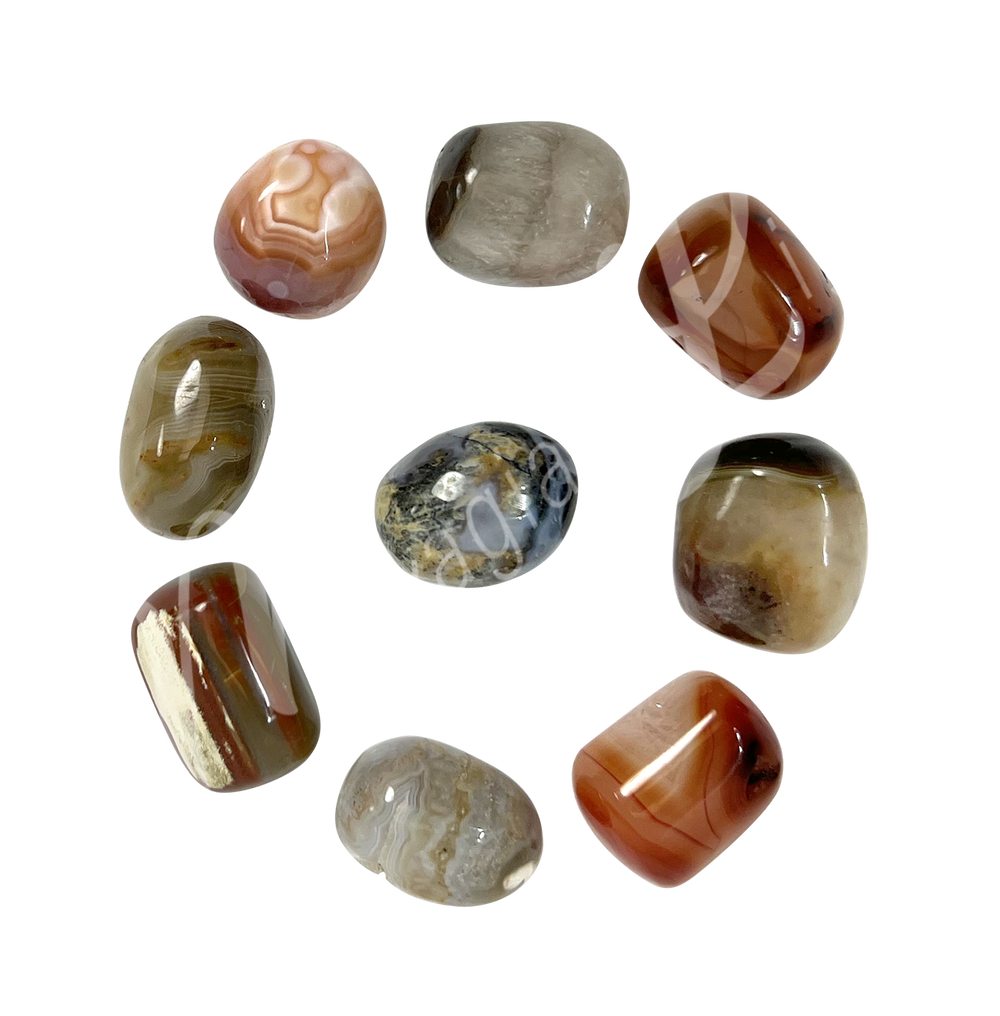 Nine Tumbled stone arranged in a crcular pattern.