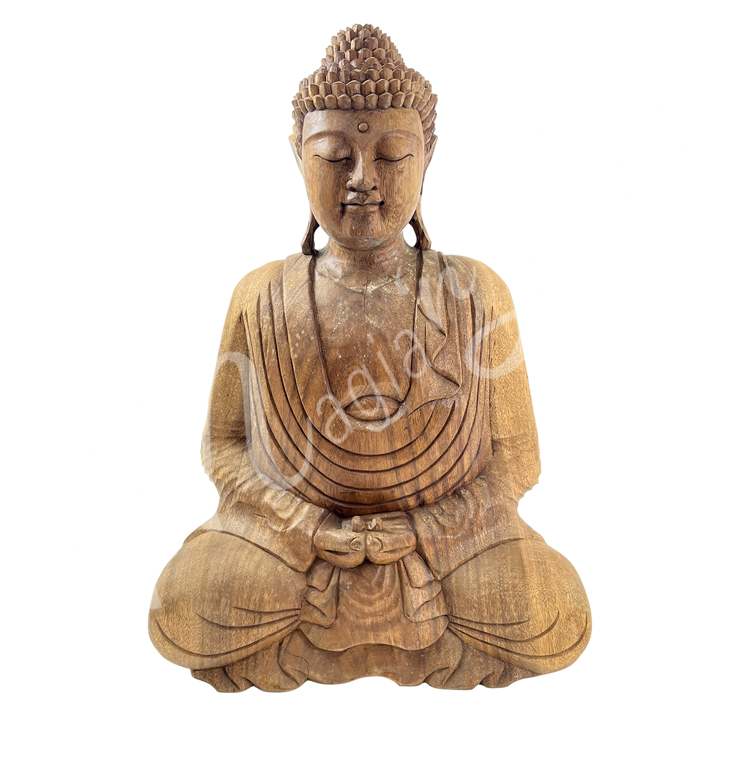 A wooden statue featuring a seated Buddha in meditation.