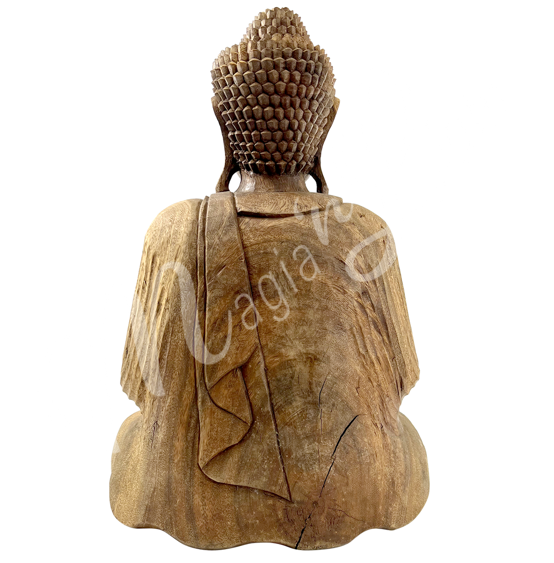 A wooden statue featuring a seated Buddha in meditation, seen from the back.