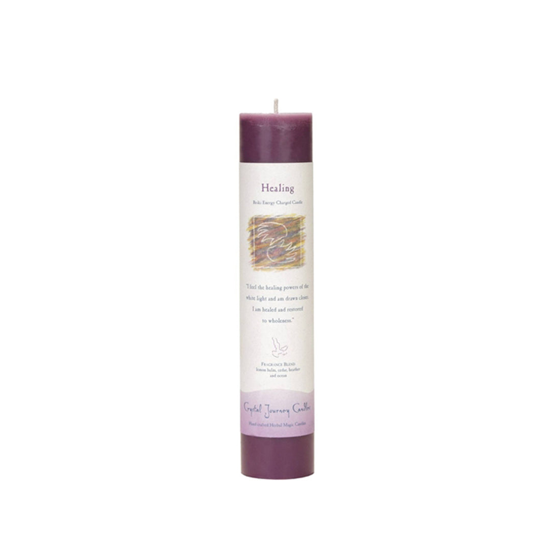 A purple pillar candle with a label that includes an inspirational message and information about the candle's purpose for healing.
